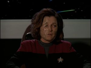 Kate Mulgrew valiantly tries to act after some dipshit has covered her face in a horrific latex crust.