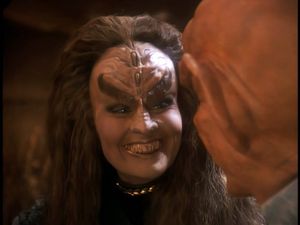 Quark's new Klingon wife Grilka smiles  warmly at him