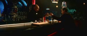 Jean-Luc Picard is standing behind the bar of 10 Forward Avenue in Los Angeles, recreated on the holodeck of the USS Titan. He and his son Jack  Crusher are toasting each other with glasses of whiskey. 