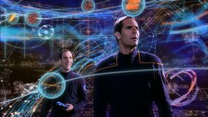 Crewman Daniels and Captain Archer are standing in a virtual-reality timeline diagram that displays complex tangles of glowing neon timelines and nodes, as well as UI elements and circuit diagrams. Daniels smiles at Archer, who is staring blankly offscreen.