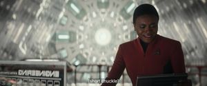 Uhura stands alone in engineering. She looks down and smiles. The song she has just finished has taught her that she is the solution to this space problem, and after everything that's happened to her, she's okay with that.