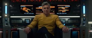 Captain Pike, relaxed as hell, leans back in the captain's chair  on the Enterprise.