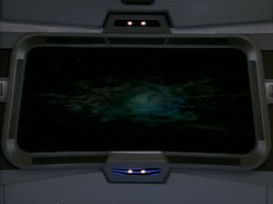 On the viewscreen in Voyager's bridge a mysterious green swirly thing is visible. Yawn.