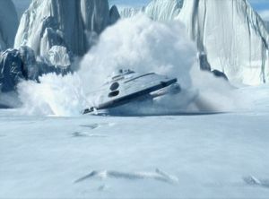 Voyager is crashing on the surface of an icy planet and skidding directly towards the camera.