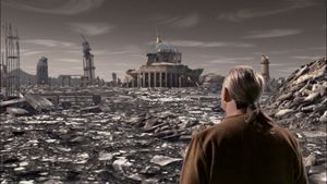 A middle-aged man with a grey ponytail stands with his back to us, looking out over the grey landscape of a ruined city.