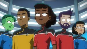 Hero shot of the Lower Deckers standing in the turbolift, lit dramatically from below: Tendi, Rutherford, Mariner, bearded Boimler and T'Lyn.