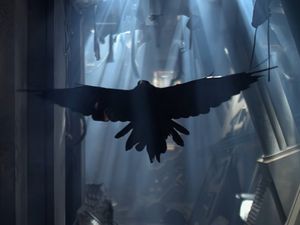 A raven, its wings outstretched, flies towards us  along a corridor in a ruined spaceship.