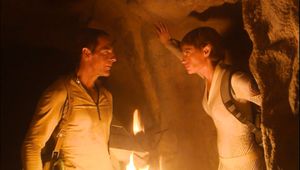 We're in the usual underground cave set. An angry T'Pol confronts a sweaty and dirty Archer, who holds a flaming torch in one hand and cradles a pyramid-shaped ancient relic in the other.